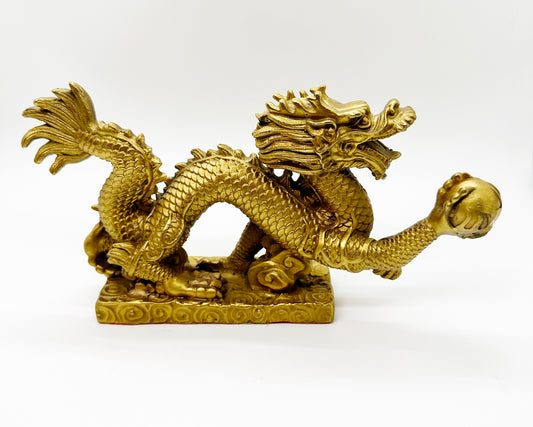 10076 - Brass Dragon Holding A Pearl - 9 Inches Length