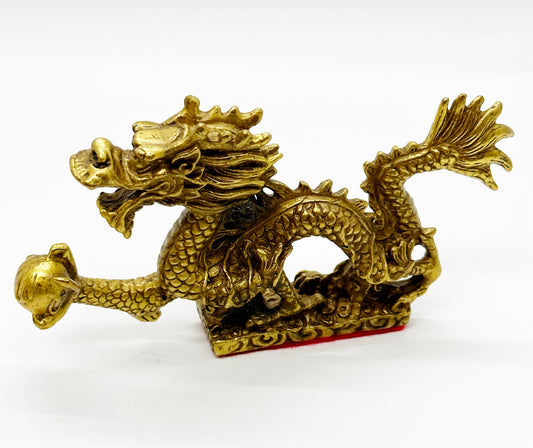 13206 - Brass Dragon Holding A Pearl - 5 Inches Length