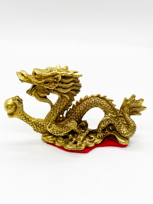 8218 - Brass Dragon Holding A Pearl - 2.75 Inches Length